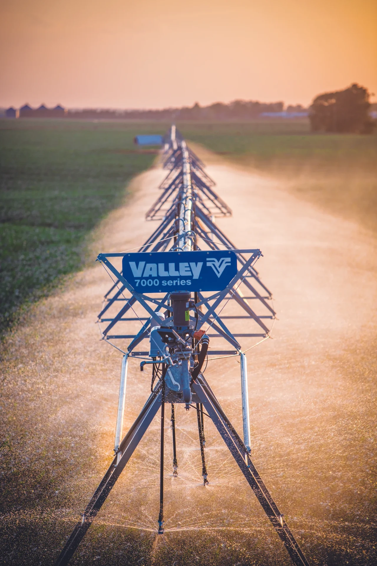 Valley 7000 series center pivot irrigating a field at sunset